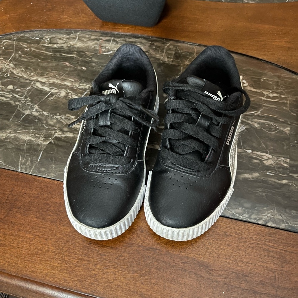 Black and silver Puma sneakers